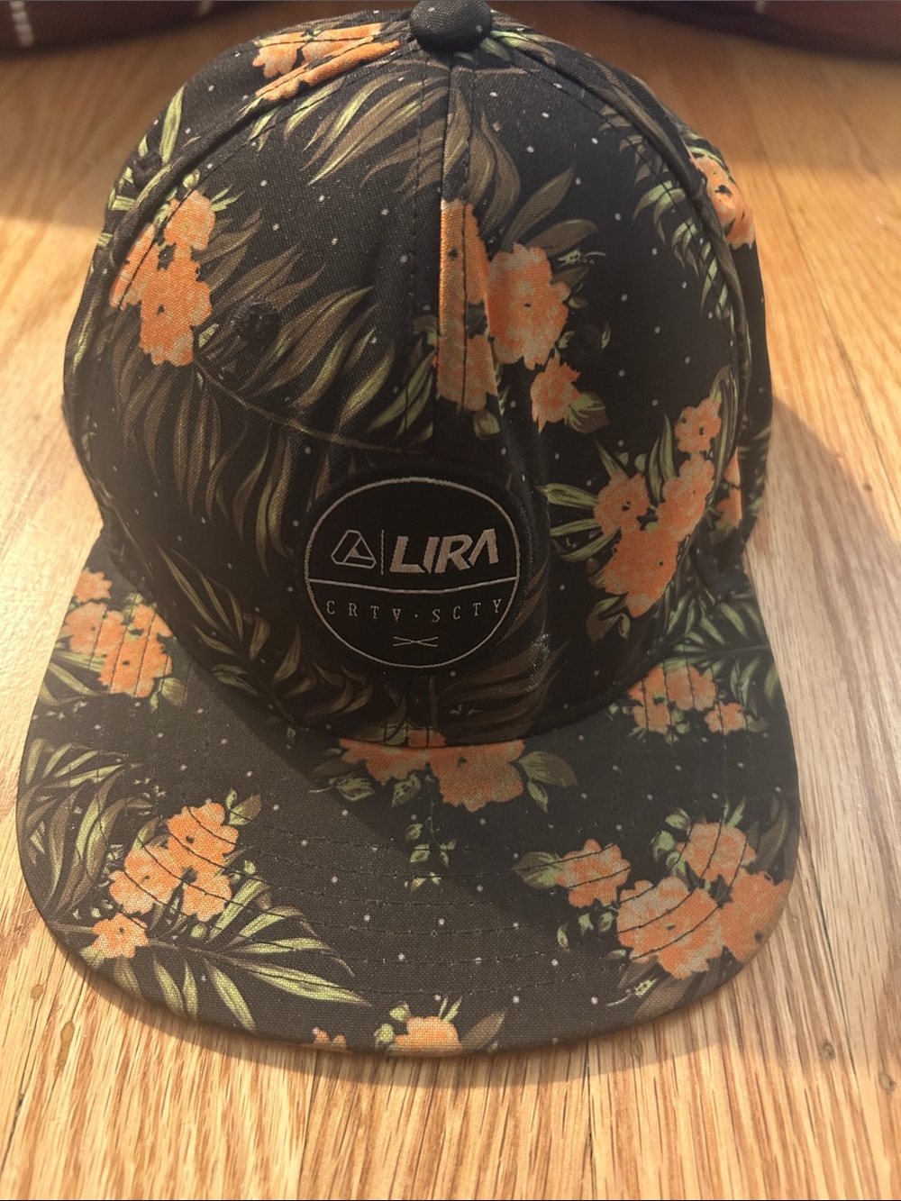 Lira Black Floral Snapback Hat with Orange Flowers
